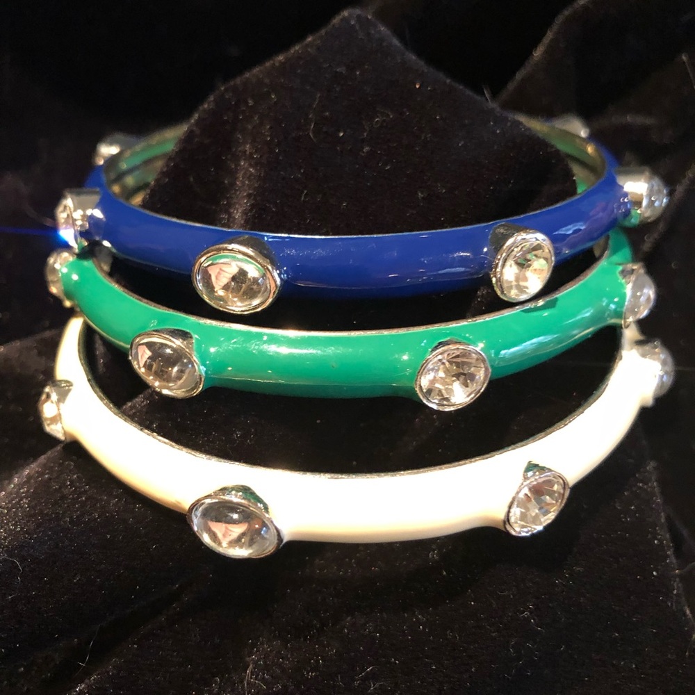 Blue, green and off-white bangled bracelets.